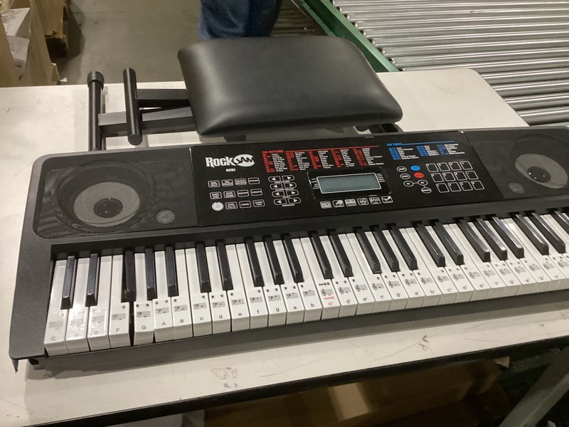 Condition photo showing As Is for Used  rack on coner of key borad RockJam RJ761 61 Key Keyboard Piano with Keyboard Bench, Digital Piano Stool, Sustain Pedal, Headphones & Lessons 61 Key Kit with Touch Display & Sustain Pedal
