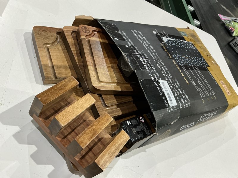 Condition photo showing As Is for (damaged )pre-oiled, non toxic 3-piece acacia cutting board set with stand, fsc certified wooden chopping boards, includes 3.4 fl oz chopping board oil, 3 wood carving boards for home, bbq kitchen, deer & oak 3 piece set