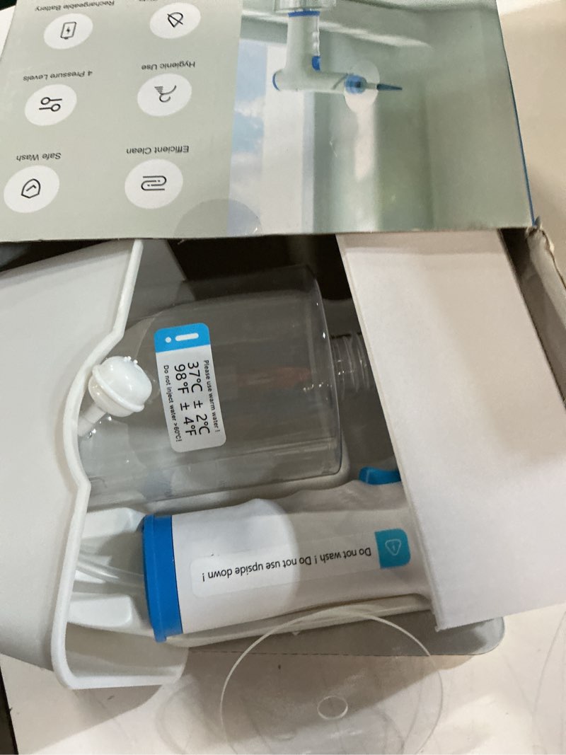 Condition photo showing As Is for ear wax removal, electric ear cleaning kit with light, fsa-hsa-eligible, ear irrigation kit with 4 pressure modes, safe and effective ear flush kit with ear cleaner - includes basin, towel & 15 tips blue