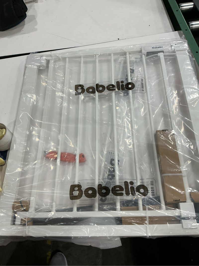 Condition photo showing Good Condition for BABELIO Baby Gate for Doorways and Stairs, 31-36" Pet Gate with Wide Walk Thru Door and Lock Indicator, No Drill Pressure Mounted Safety Gate with Double Lock and Self-Closing, White White 31-36"W, 30"H