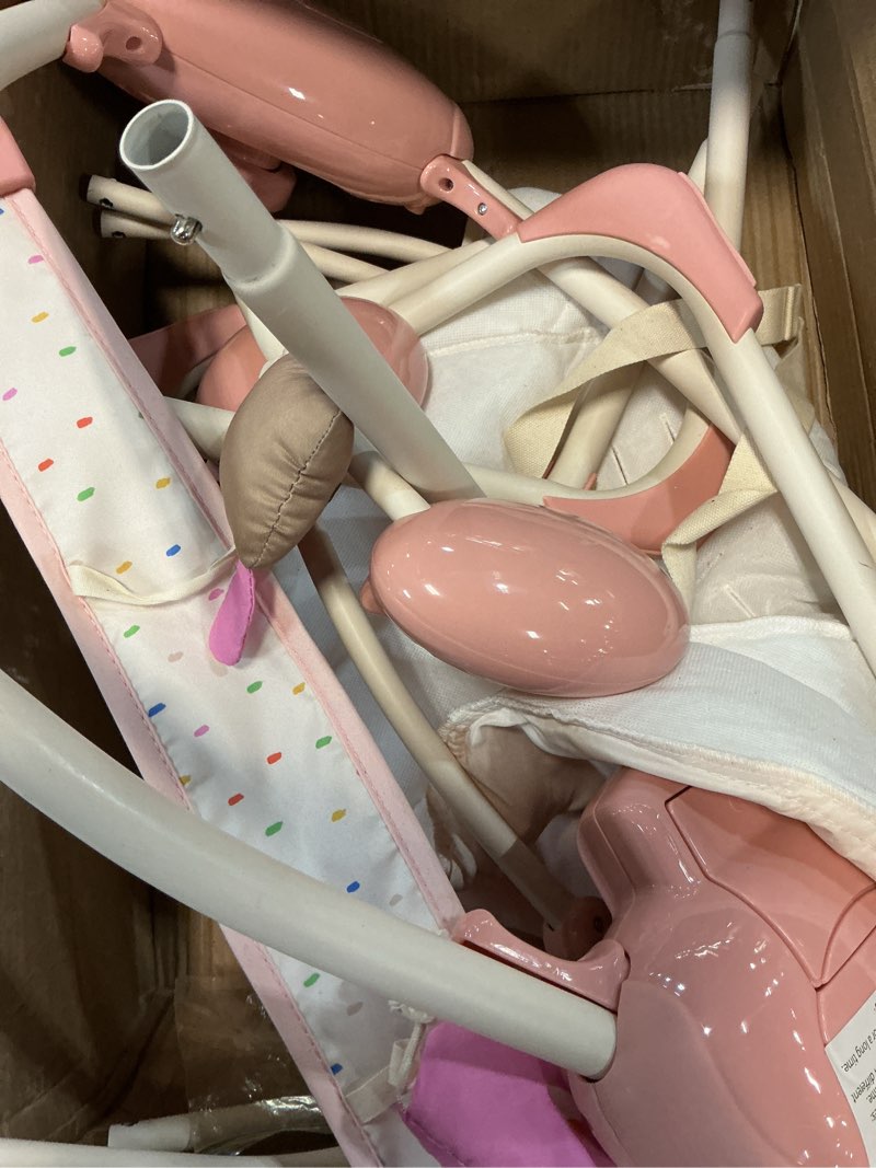 Condition photo showing As Is for baby swings for infants, tiny marvels foldable swing with music,0-9m, 20lbs | five swing speeds, dual power supply, five-point harness, auto shutoff timer, sensory toy bar blush bloom