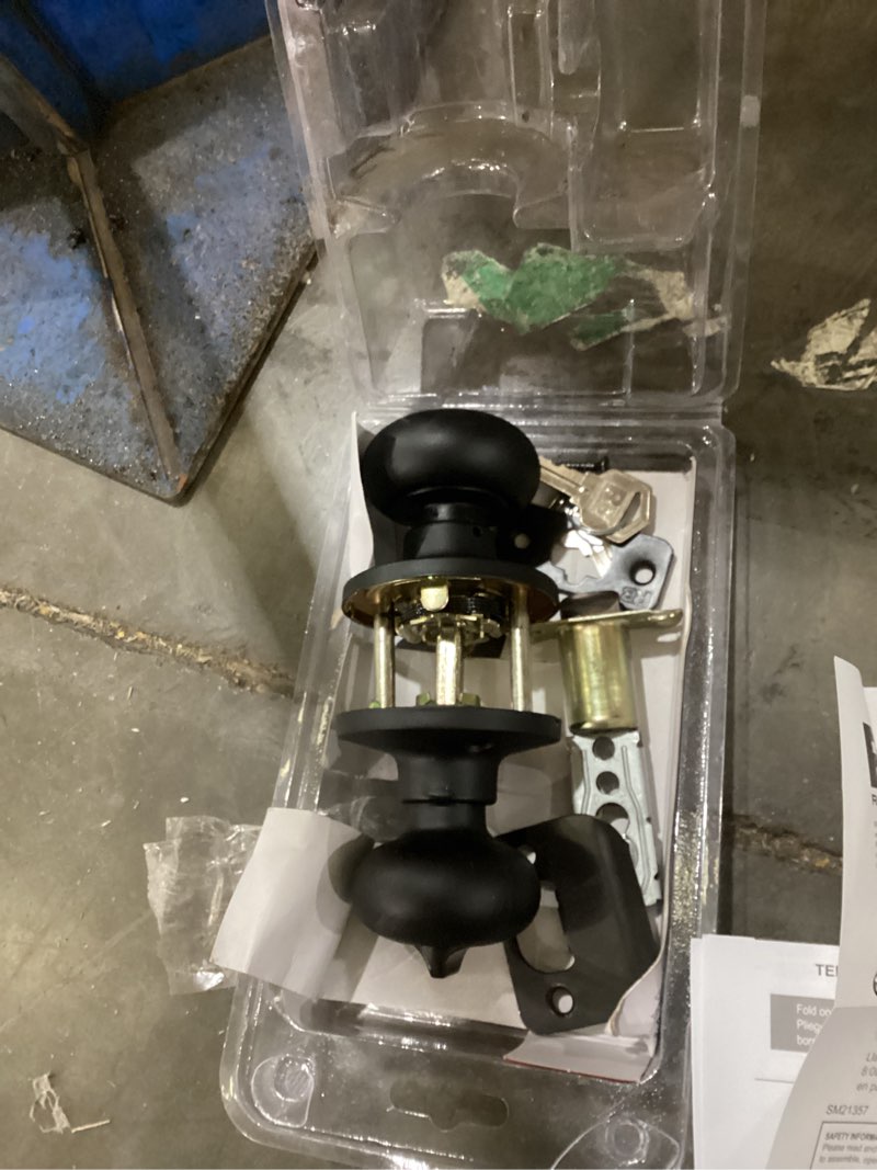 Condition photo showing As Is for reliabilt baron matte black interior or bed/bath privacy door knob 