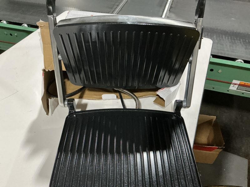Condition photo showing As Is for Hamilton Beach Panini Press, Sandwich Maker & Electric Indoor Grill, Upright Storage, Nonstick Easy Clean Grids, Stainless Steel (25410) Stainless Steel Nonstick 8" x 10" Grids