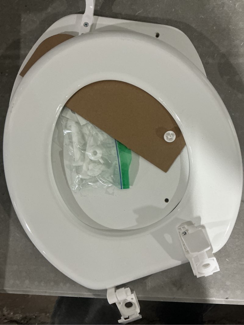Condition photo showing As Is for damaged project source wood white round toilet seat
