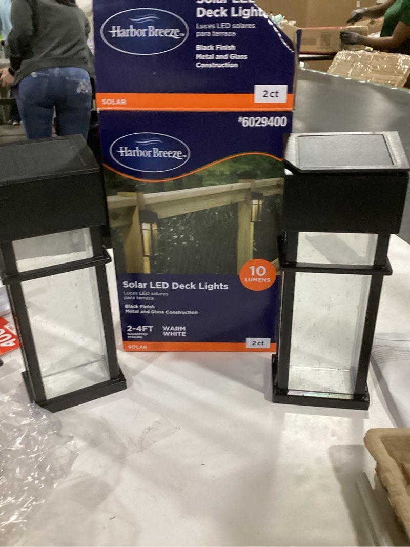 Condition photo showing As Is for ••as is•• (cracked top on light) harbor breeze solar black led outdoor wall light kit 2 -pack
