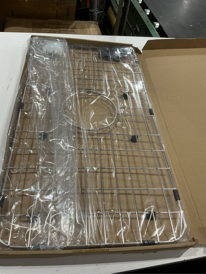 Condition photo showing Good Condition for serene valley sink bottom grid 24-1/8" x 12-5/8", centered drain with corner radius 1-1/2", sink protector nlw2412c
