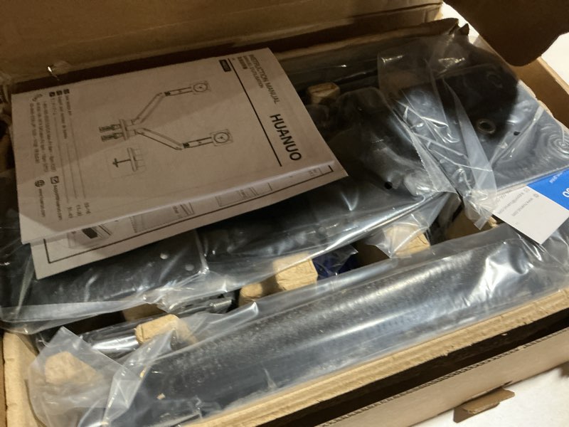 Condition photo showing As Is for HUANUO NITROGLIDE™ Dual Monitor Stand for 13?–40?, Premium Dual Monitor Mount with USB, Height Adjustable Monitor Stand for 2 Monitors, VESA Mount with Clamp/Grommet Base, Holds 26.4lbs per Arm, HNDS7 13-40 Inch