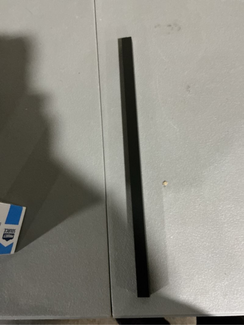 Condition photo showing As Is for project source seton 18-in matte black wall mount single towel bar