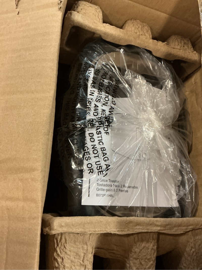 Condition photo showing Good Condition for amazon basics 2 slice toaster, extra wide slots for bagels, 6 browning settings, removable crumb tray, defrost/cancel/bagel buttons, cord wrap, 900w, black & silver 2 slice silver front