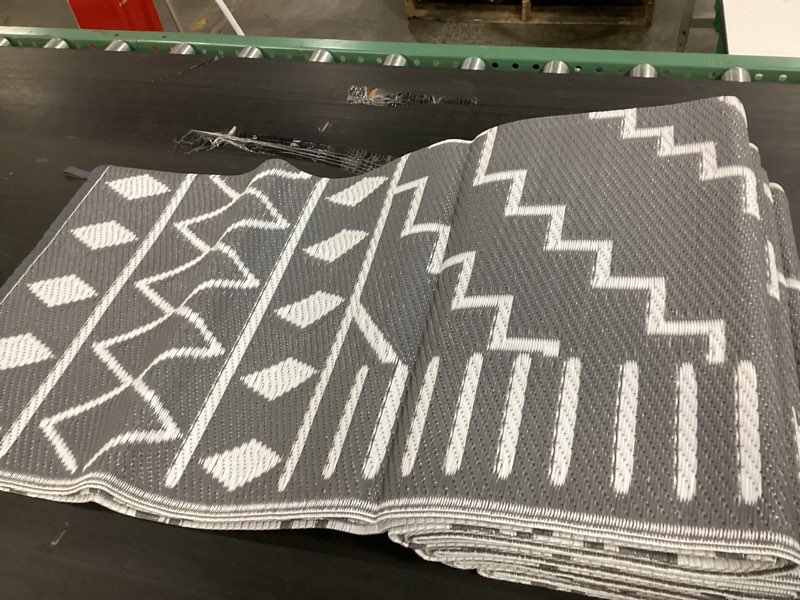 Condition photo showing Good Condition for (similar to stock photo, diamond pattern, reversible, stakes included to secure into ground) waterproof outdoor rug 9x12 ft, outdoor plastic straw rug for camping, rv mat outside, outdoor carpet for porch, deck, backyard, balcony, picnic, grey & white 9' x 12' (rectangular) grey & white