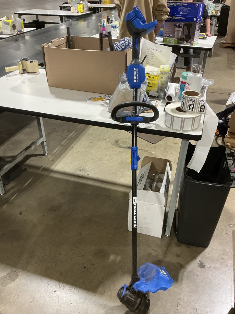 Condition photo showing As Is for kobalt quiet tech 24-volt 15-in straight shaft battery string trimmer no battery or battery charger