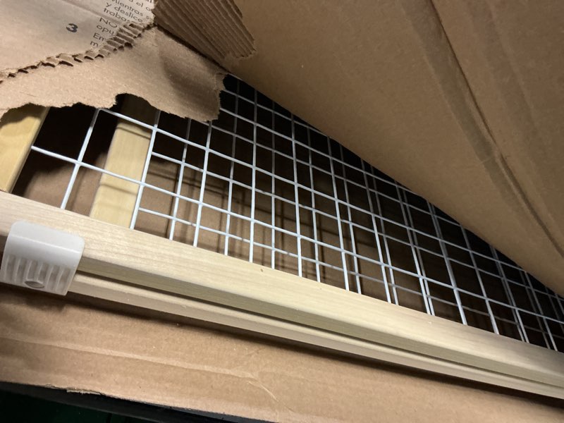 Condition photo showing As Is for wide wire mesh pet gate-color:white