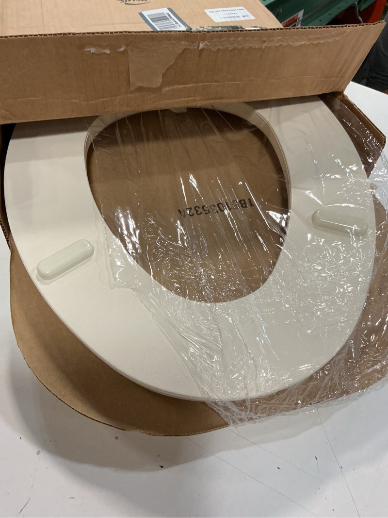 Condition photo showing Good Condition for mayfair padded toilet seat, cushioned soft vinyl over wood core seat, secure hinges, easy clean, made in usa, elongated, bone round bone toilet seat