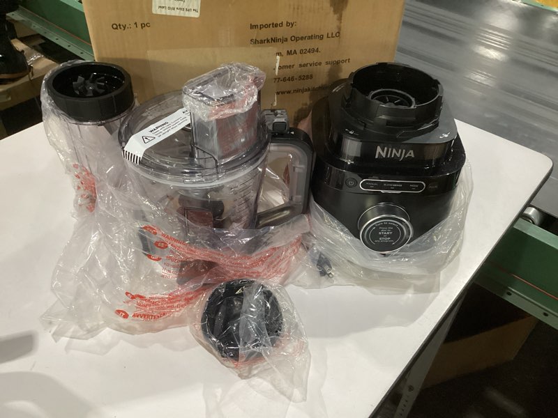 Condition photo showing As Is for ninja kitchen system | all-in-one food processor & blender | with 8-cup bowl & (1) 24 oz. to-go cup | for smoothies, cookie dough, salsas, cole slaw & more | 1800 watt | black | tb401 blender + bowl + (1) 24-oz. cup, not tested, 1 blender cracked