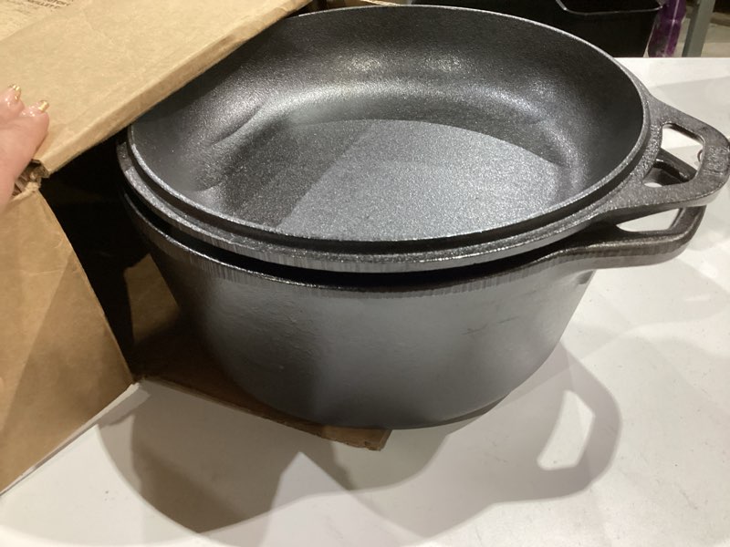 Condition photo showing Good Condition for Lodge 5 Quart Cast Iron Double Dutch Oven – Pre-Seasoned – Lid Converts to 10.25" Skillet – PFAS-Free – Made in USA – Dual Handles – Oven, Grill, Campfire & Stovetop Safe – Durable & Non-Toxic 5 Quart Double Dutch