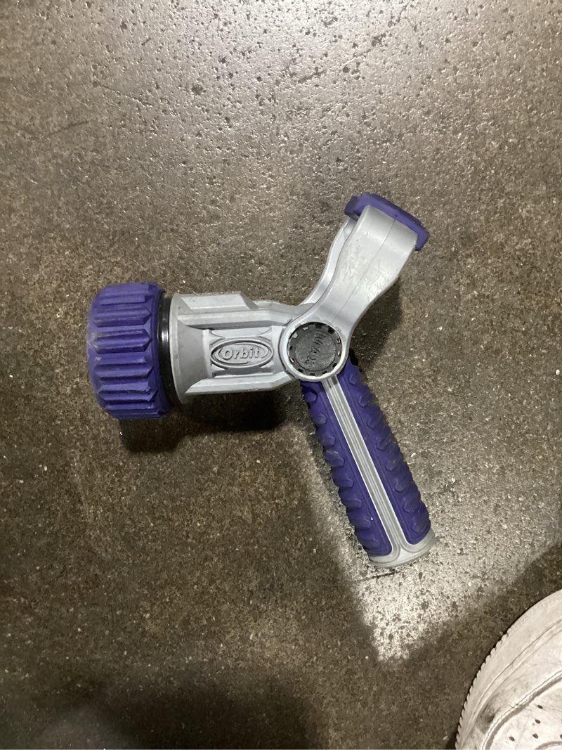 Condition photo showing Good Condition for orbit 7-pattern fireman's nozzle with a grey metal body, purple rubber grip