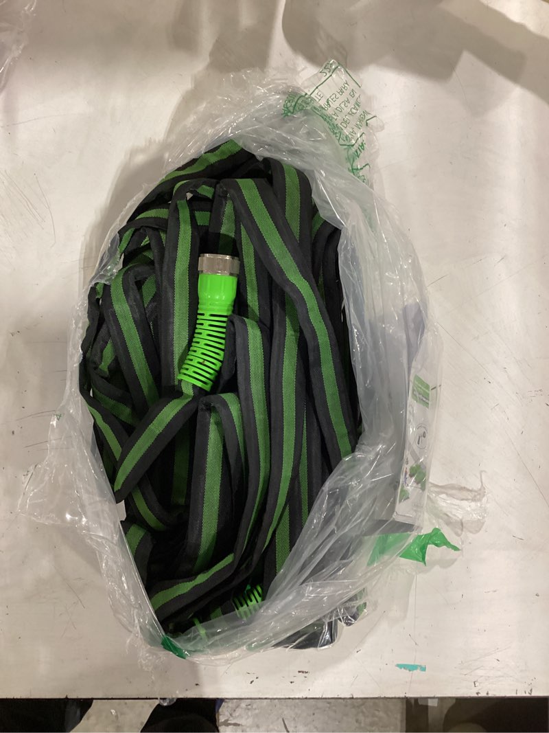 Condition photo showing As Is for rainpoint 50ft flat soaker hose, flexible & leakproof drip hose with anodized aluminum fittings, double layer 80% water-saving gardening irrigation hose, green