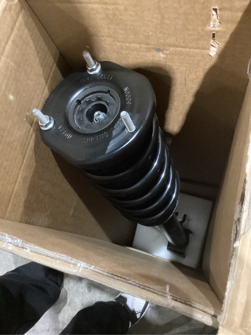 loaded strut assembly. This type of strut comes as a complete, pre-assembled unit, including the strut, coil spring, and upper mount. 