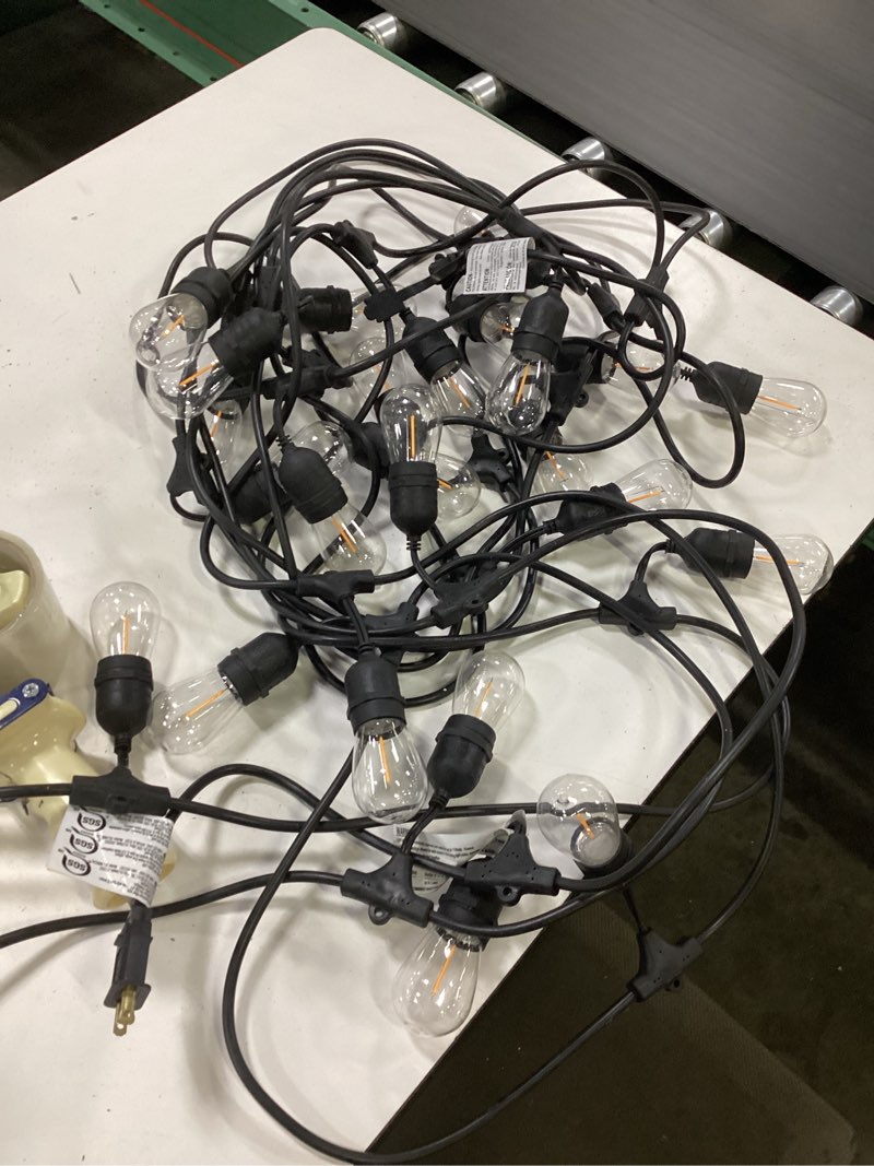 Condition photo showing As Is for  harbor breeze 48-ft plug-in black indoor/outdoor string light with 24 white