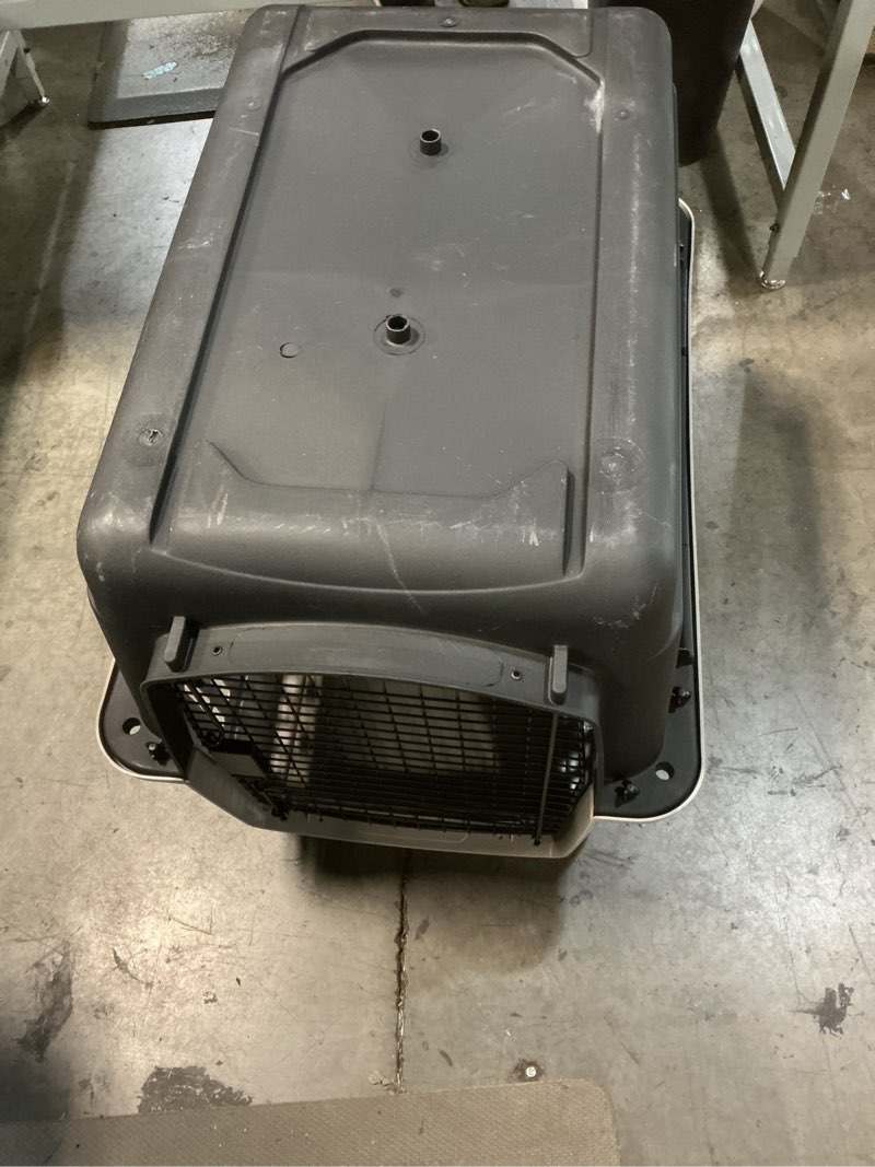 Condition photo showing As Is for vibrant life large plastic hard-sided pet carrier, black and gray, 90 lb limit