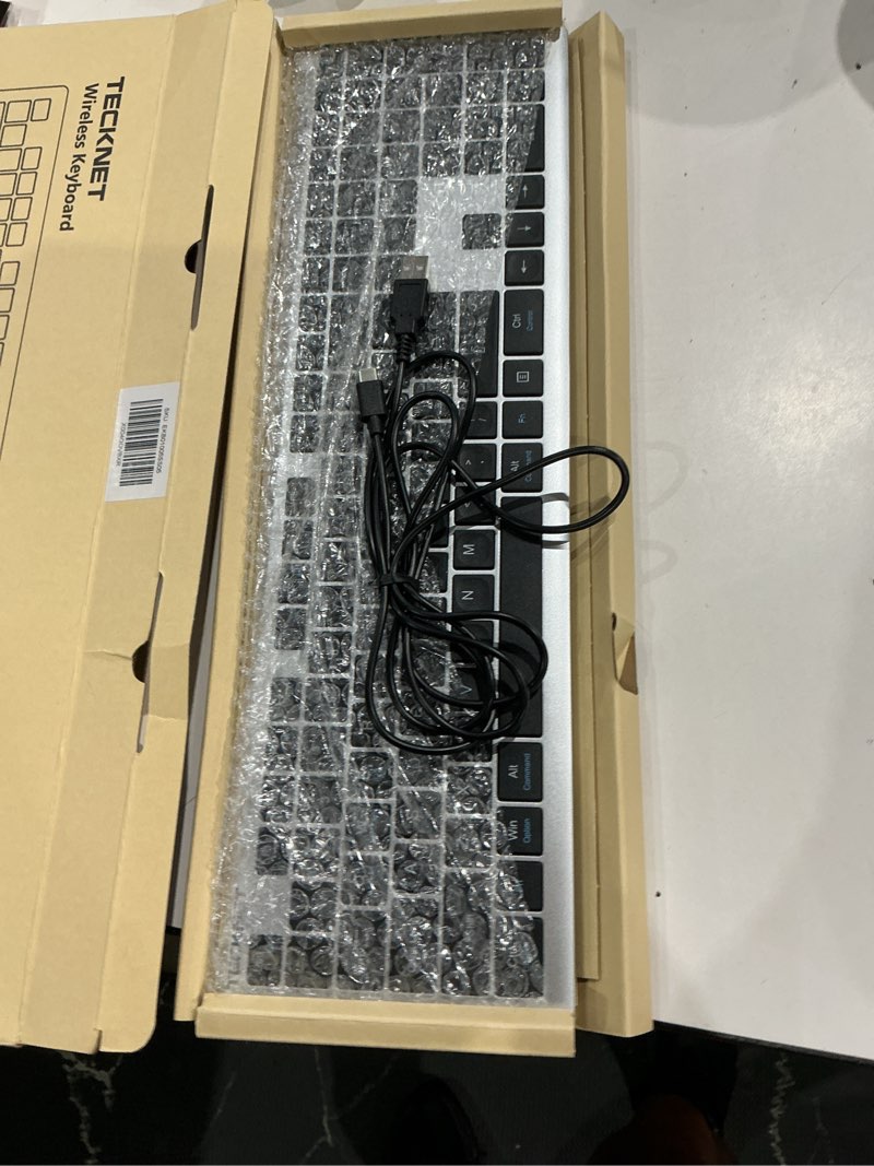 Condition photo showing As Is for tecknet bluetooth keyboard rechargeable, 4-device free switching (2.4g+bt), ultra-slim full size wireless keyboard, quiet typing, for pc/laptop/smart tv/phone, adjustable stand, 12 multimedia keys silver&grey