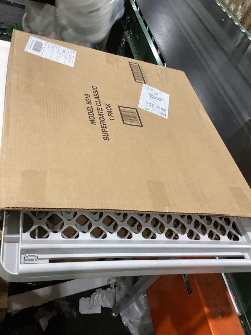 Condition photo showing Good Condition for mypet universal pet gate: 26” - 42” wide dog gate for doorways with pressure fit or swinging door hardware mounting types included: 26" tall; gray