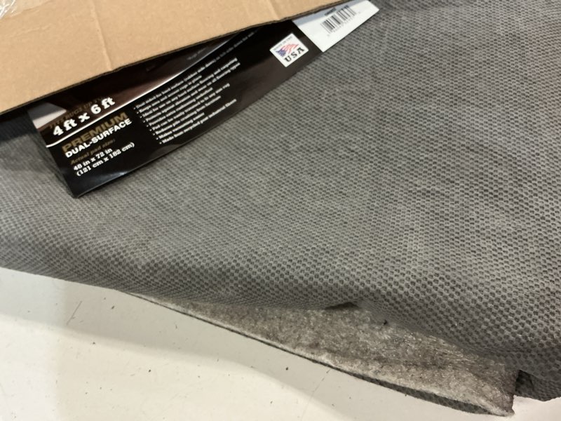 Condition photo showing As Is for mohawk home non slip rug pad 4' x 6' (rectangular)- 1/4" thick felt + latex rubber gripper - dual surface cushion for hardwood, carpet, tile floors, made in usa 1/4 inch dual surface rug pad 4' x 6' (rectangular)
