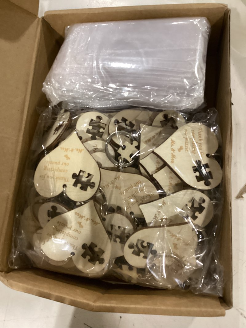 Condition photo showing New/Like New for 50 sets wedding souvenir for guests includes wood heart puzzle keychain cards and gift bags rustic wedding favors for guests