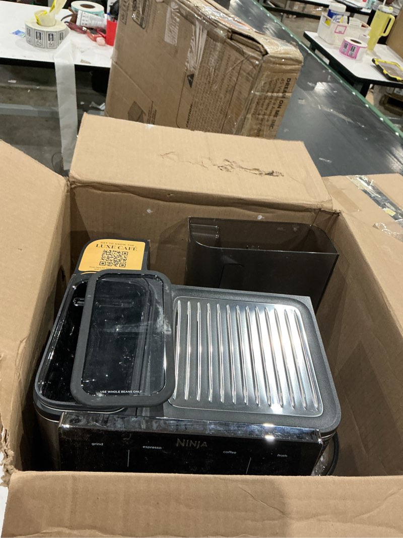 Condition photo showing As Is for ninja luxe café 3-in-1 espresso, drip coffee and cold brew machine | integrated coffee grinder, milk frother, assisted tamper & built-in espresso accessory storage | stainless steel | es601 luxe cafe stainless steel