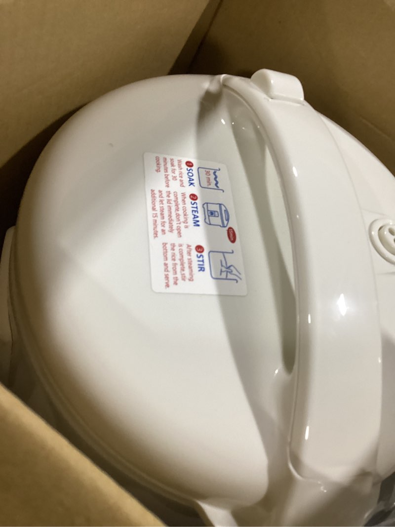 Condition photo showing Good Condition for Tiger JNP-0550-LF 3 Cup Capacity White Rice Cooker with Non-Stick Inner Pot, Retractable Power Cord, and Keep Warm up to 12 hours (Flower)