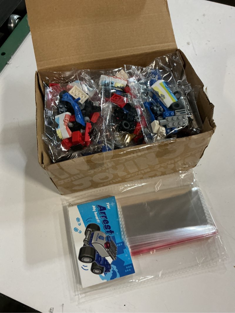 Condition photo showing New/Like New for JOYIN 24 Pcs Valentine's Day Mini Truck Building Blocks with Cards, Small Fire Truck, City Police Car, Construction Vehicle for Kids, Valentines Day Gift Exchange, Classroom Party Favor Prize