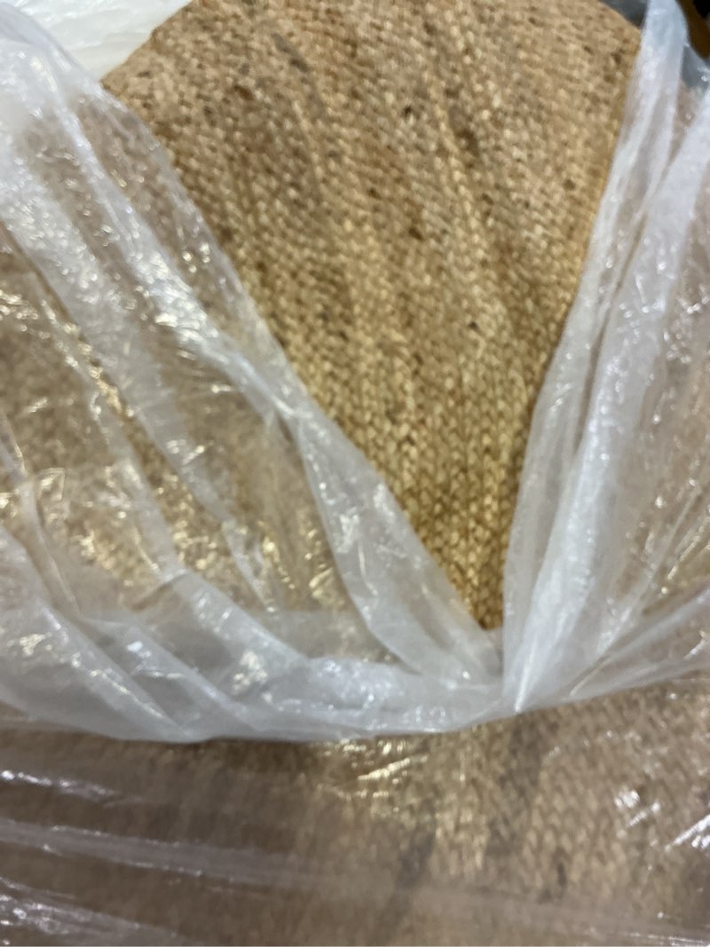 Condition photo showing As Is for FRELISH DECOR Handwoven Jute Area Rug - 5 feet Round - Natural Yarn - Rustic Vintage Beige Braided Reversible Rug - Eco Friendly Rugs for Bedroom - Kitchen - Living Room - Farmhouse (5' Round) Natural 5' (Round)