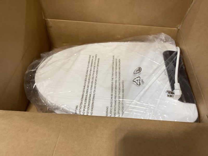 Condition photo showing As Is for electric heated bidet toilet seat with warm water wash, warm air dryer, soft closed lid, night light, led display, toilet seat with bidet requires outlet - elongated