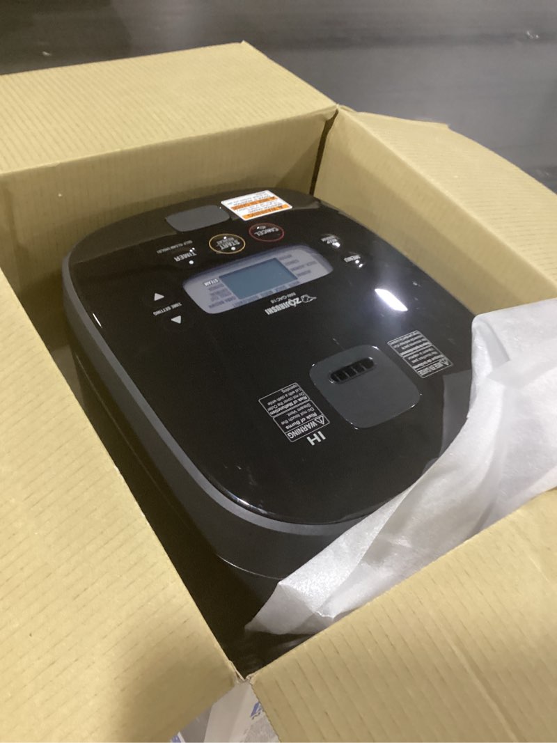 Condition photo showing As Is for Zojirushi NW-QAC18 10-Cup Capacity Flat-Top Induction Cooker and Warmer with Custom Cooking Pan, Double Nonstick Coating for Easy Clean-Up (Black) 10.375 x 13.375 x 9 10 CUP