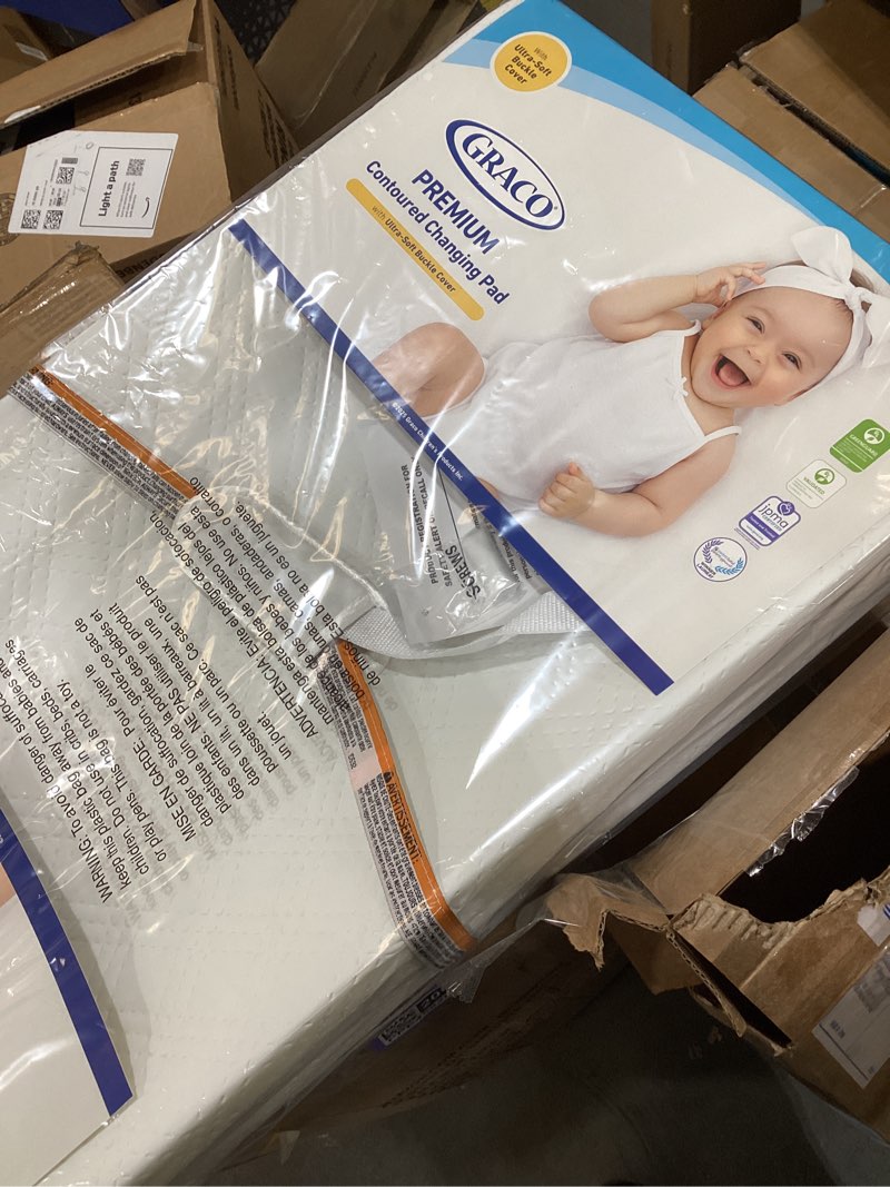 Condition photo showing New/Like New for Graco Premium Contoured Changing Pad – GREENGUARD Gold Certified, Water-Resistant, Ultra-Soft Buckle Cover, Contoured Baby Changing Pad, Fits Most Standard-Size Changing Toppers, Non-Skid Bottom