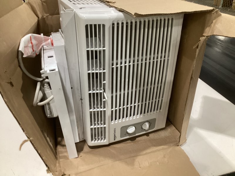 Condition photo showing As Is for (size and model unknown, used)amazon basics small window air conditioner