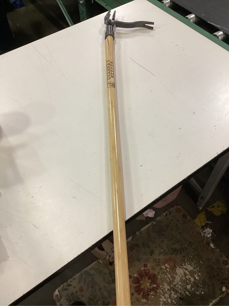 Condition photo showing As Is for grampa's weeder - the original stand up weed puller tool with long handle - made with real bamboo & 4-claw steel head design - easily remove weeds without bending, pulling, or kneeling.