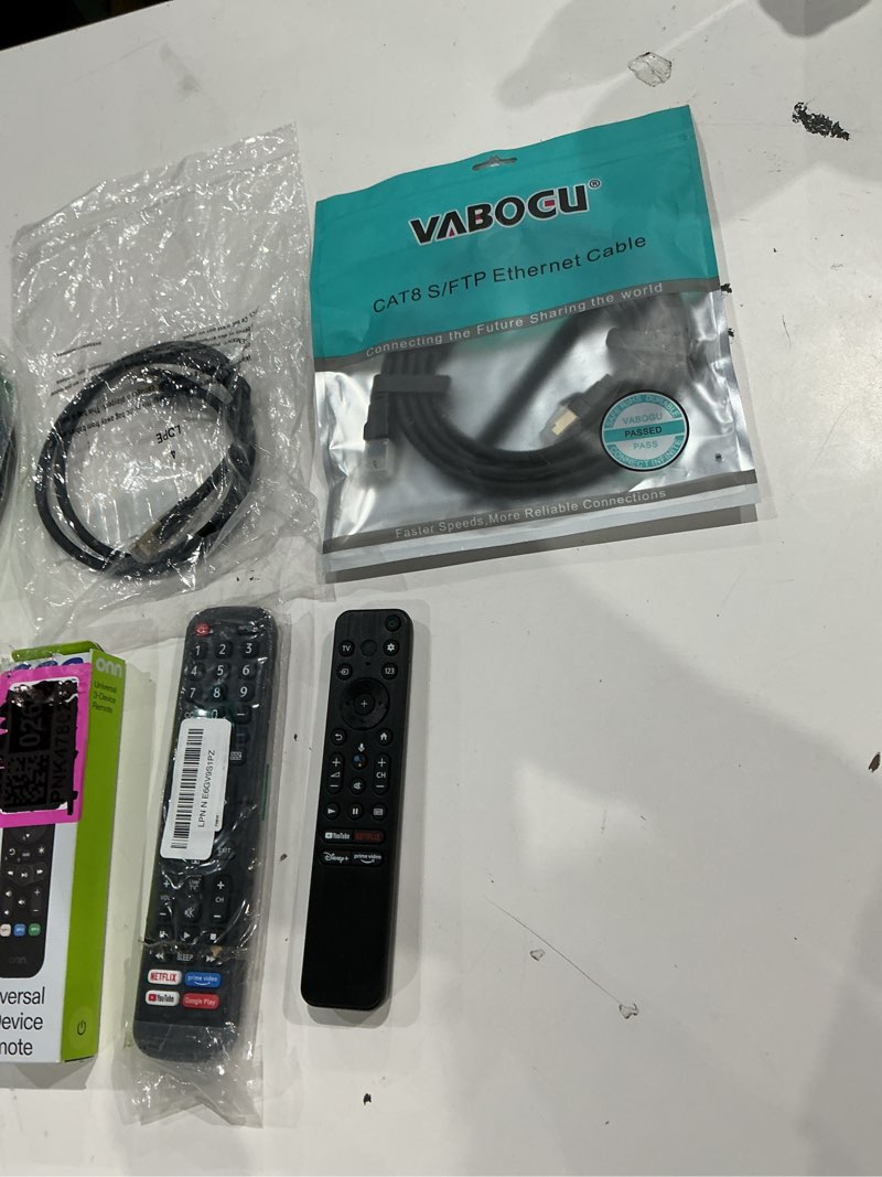 Condition photo showing As Is for assorted lot of electronics (headphones, small gadgets, headsets, etc.) 
