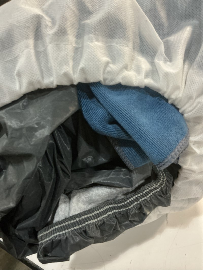 Condition photo showing As Is for 16 Layers Car Cover Waterproof All Weather, Heavy Duty Outdoor Car Cover Universal Fit Sedan Coupe Chevrolet Caprice, Buick Roadmaster/Riviera, Ford Crown Victoria, Cadillac DTS etc. 1 Sedan Car Cover 1 Fit Sedan Length 209-218 inch