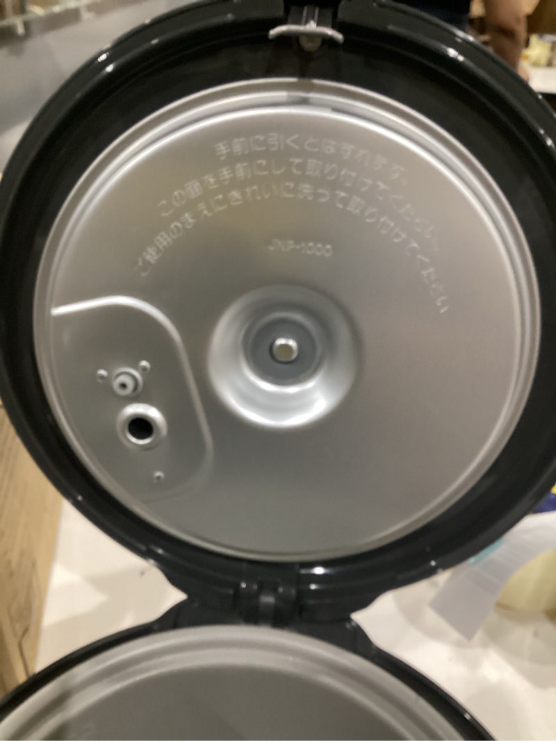 Condition photo showing As Is for tiger jnp-s10u-ky 5.5 cup capacity rice cooker with non-stick inner pot, retractable power cord, and keep warm up to 12 hours, black