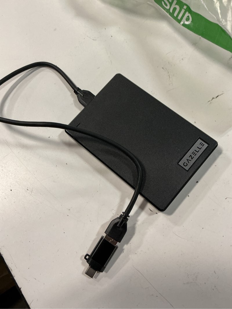 Condition photo showing As Is for gazelle high-speed 1tb ultra slim portable external hard drive - 2-in-1 type c & usb 3.0, compatible with pc, mac, laptop, ps4, xbox, ipad, tablet, mobile (black) - 1 year warranty 1 tb fabric texture black