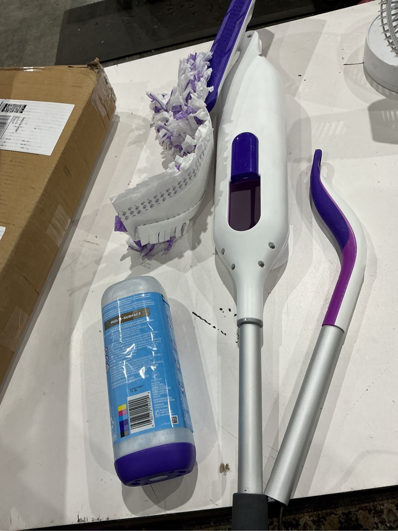 Condition photo showing As Is for swiffer powermop multi-surface mop kit for floor cleaning, fresh scent, mopping kit includes powermop, 2 mopping pad refills, 1 floor cleaning solution with fresh scent and 2 batteries purple and white