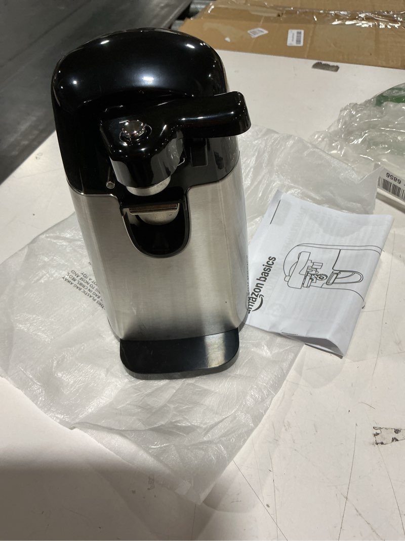 Condition photo showing New/Like New for amazon basics 3-in-1 electric can opener, bottle opener and knife sharpener, with stainless steel blade, magnetic lid holder, automatic, countertop, 50w, black
