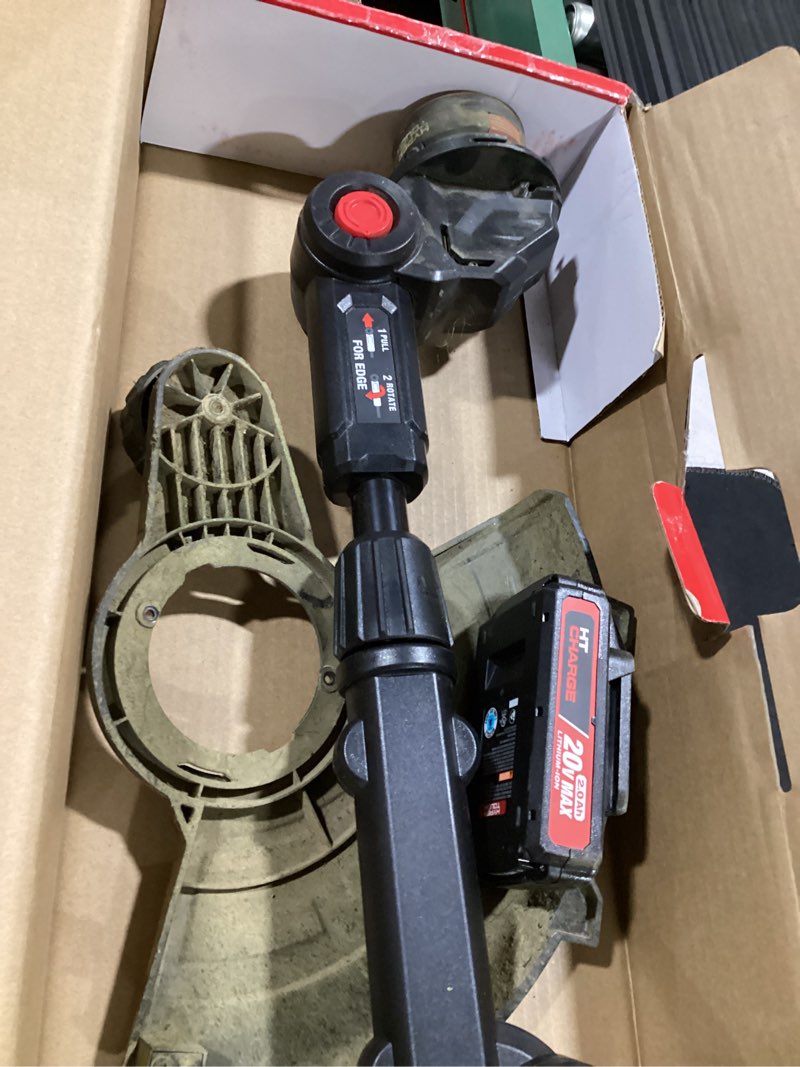 Condition photo showing As Is for hyper tough 12" 20v brushless cordless string trimmer with 20v max 2.0ah battery and charging cable