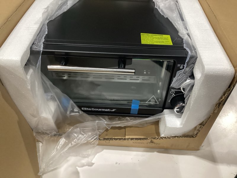 Condition photo showing As Is for elite gourmet eto490 9l/4 slice countertop toaster oven with 30-minute timer, adjustable temperature control, includes baking pan and wire rack, bake, broil, toast, black, not tested, incomplete