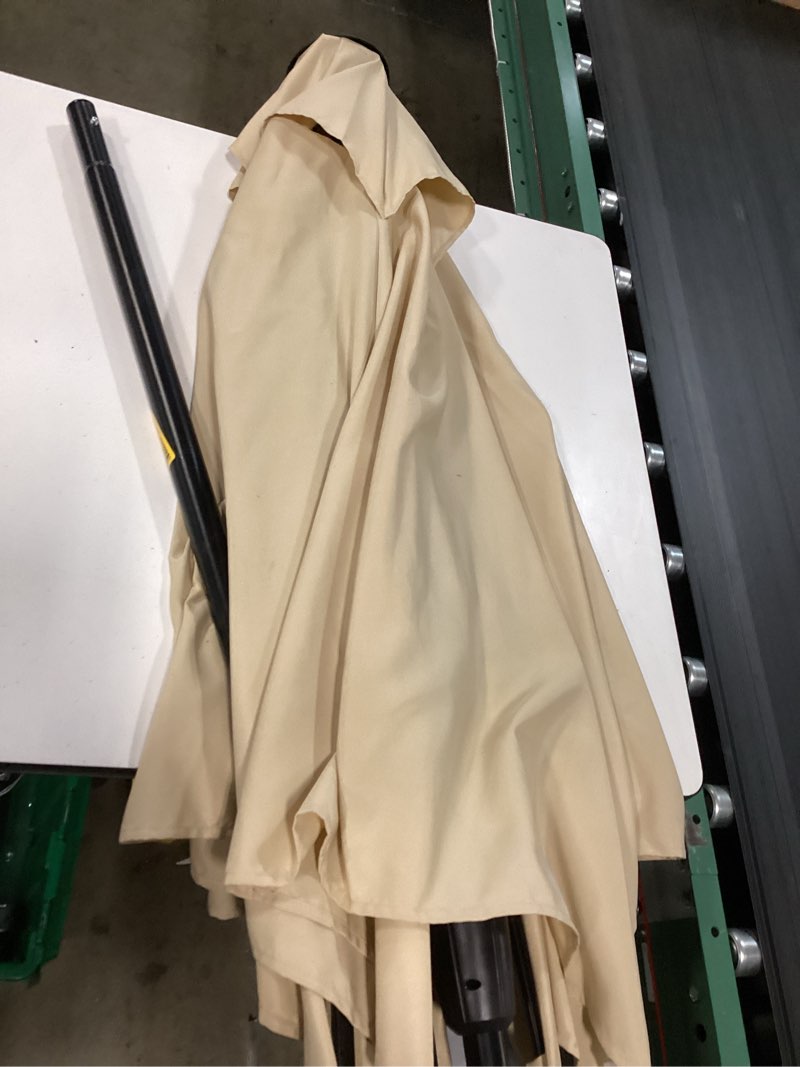 Condition photo showing As Is for pure garden 10-ft steel tan market patio umbrella