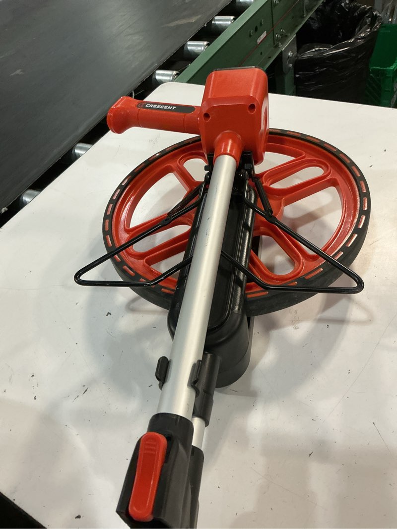 Condition photo showing As Is for 12 in. sae measuring wheel