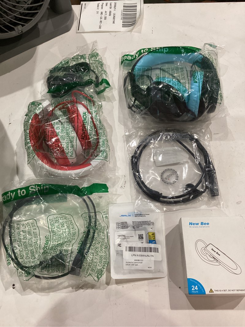 Condition photo showing As Is for assorted lot of electronics (headphones, small gadgets, headsets, etc.) 