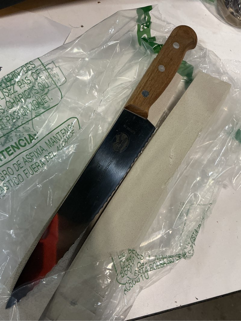 Condition photo showing Good Condition for victorinox 7-1/2-inch wavy edge chef's knife/carver, rosewood handle