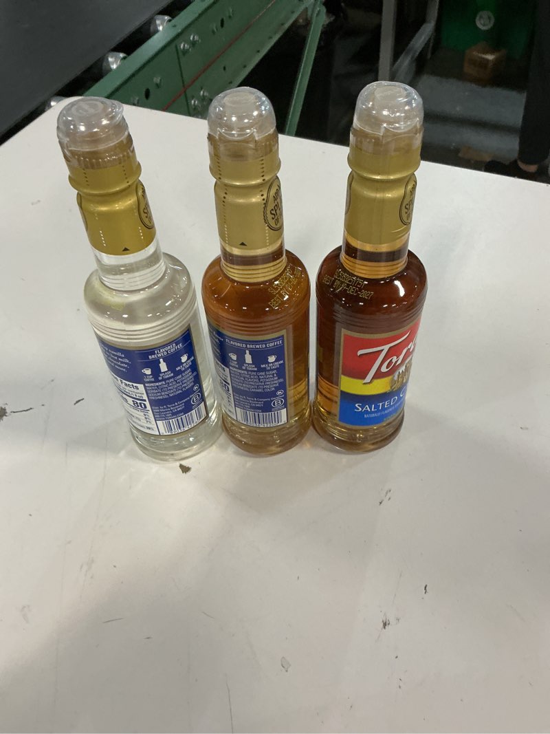 Condition photo showing Good Condition for ( incomplete)( BB/21/DEC/2027) Torani Flavored Drink Syrup Café Variety Pack, Vanilla, Salted Caramel, Classic Hazelnut & French Vanilla, 12.7 fl oz (Set of 4)